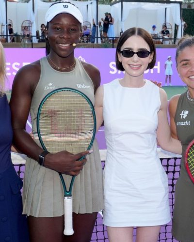 Lily Collins in a casual white dress with black footwear