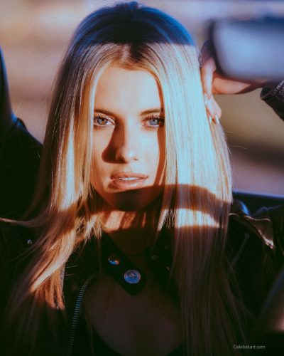 Lindsay Brewer in a classy burgundy dress with a modern twist.