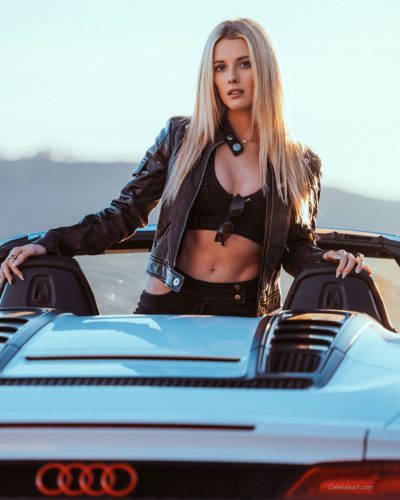 Lindsay Brewer a fitted burgundy dress with vibrant appeal.