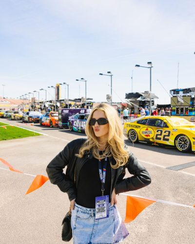 Lindsay Brewer wearing a trendy burgundy gown that captures attention.