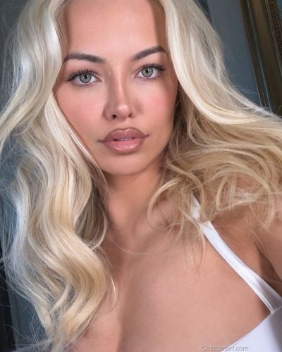 Lindsey Pelas in bold animal print bandeau and black blazer