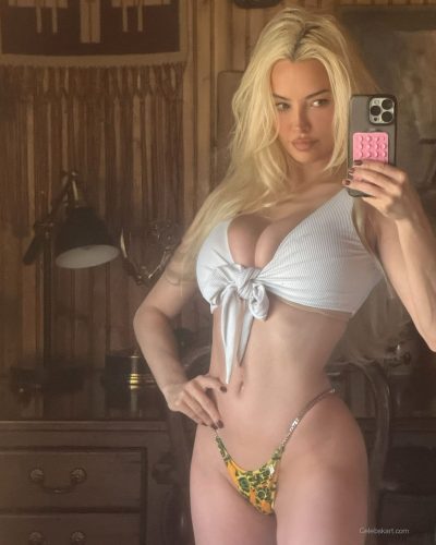 Lindsey Pelas in leopard print bikini with classic black blazer