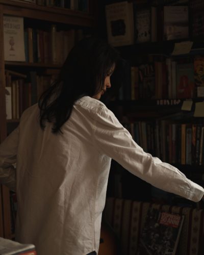 Liza Makhu featuring a white shirt and chic blue denim.