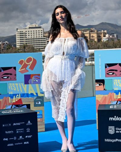 Lola Rodriguez wearing sheer white dress with layered textures