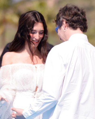 Lola Rodriguez in white dress with textured layers and lace