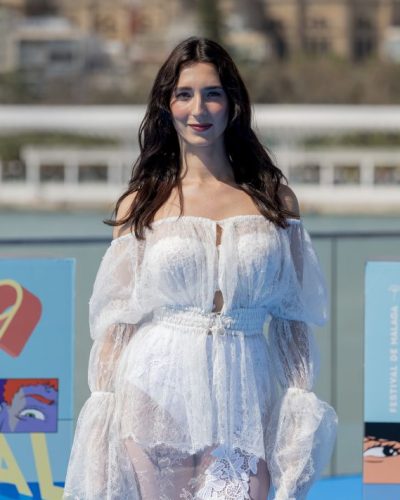 Lola Rodriguez in flowing white gown with delicate lace details