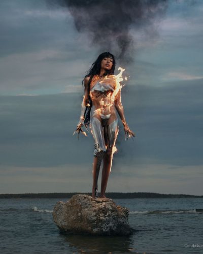 Loreen metallic cropped top in silver with high-waisted trousers.