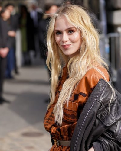 Loreto Peralta in brown dress complemented by edgy bomber jacket