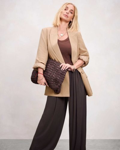 Louise Redknapp with soft waves and brown belted shirt.