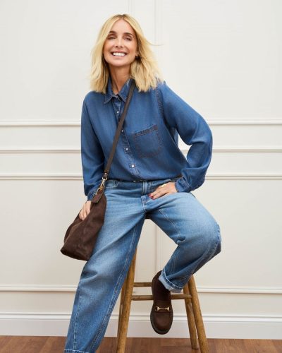 Louise Redknapp in a relaxed brown shirt and cream trousers.