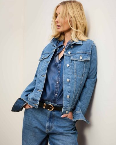 Louise Redknapp in a brown shirt and tailored cream trousers.