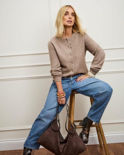 Louise Redknapp dressed in brown belted shirt and cream pants.