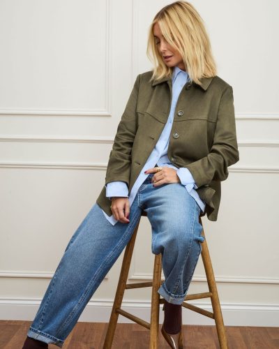 Louise Redknapp sporting a brown shirt and light cream trousers.