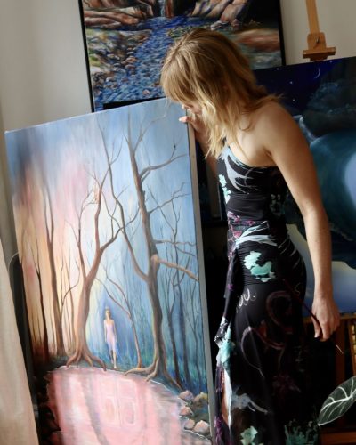 Lucy Fry light-colored dress with intricate craftsmanship