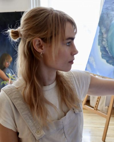 Lucy Fry charming dress featuring soft hues and lace