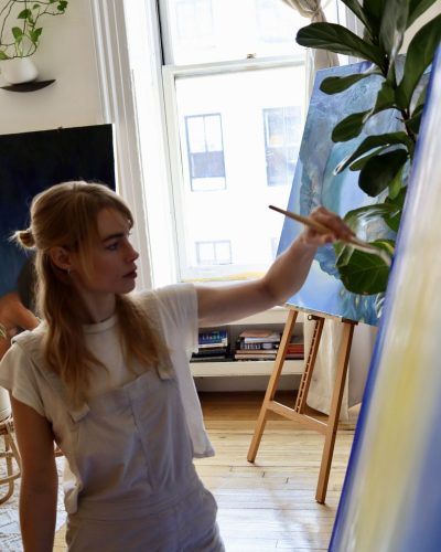 Lucy Fry delicate lace dress in soft pastel colors