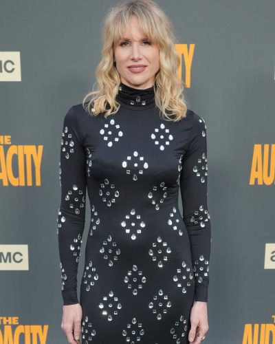 Lucy Punch black gown featuring a striking side slit design