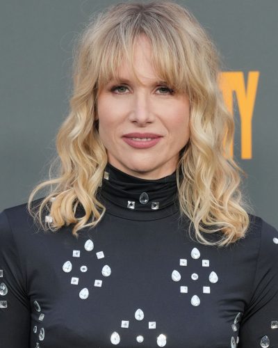 Lucy Punch black dress complemented by stylish strappy heels