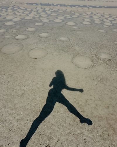 Madalina Ghenea in chic white bikini enjoying tropical breeze.