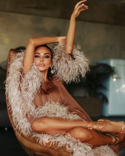 Madalina Ghenea brown gown with a blend of form and flow