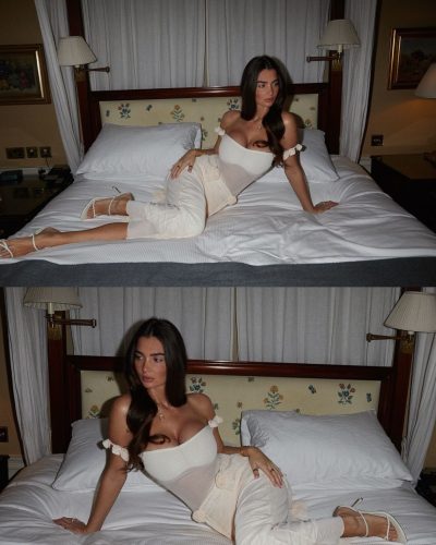 Maddy Cheary in flowing white dress against soft linens