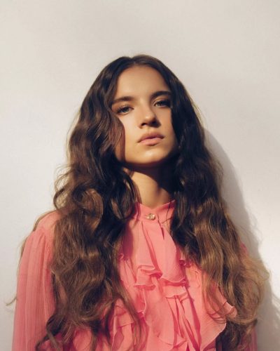 Madeleine McGraw in pink dress with cinched waist detail