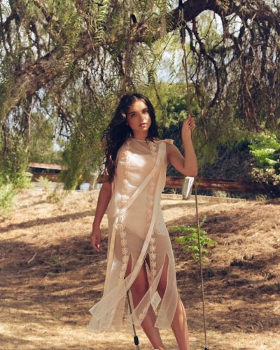 Madeleine McGraw in pink dress complemented by dark belt