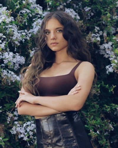 Madeleine McGraw wearing pink ruffled dress with layered design