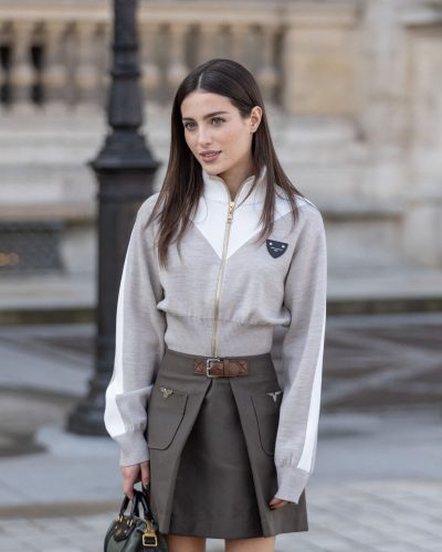 Madeline Argy knee-high boots enhancing khaki skirt and beige top