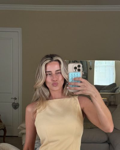 Madeline Hope wearing classic cut orange bikini with adjustable straps