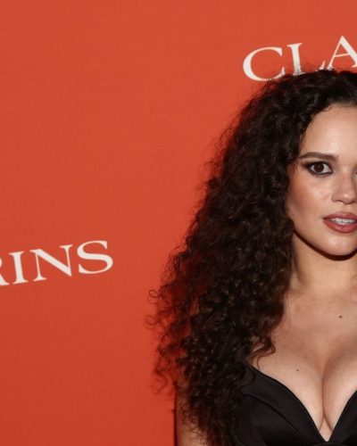 Madison Pettis black fitted dress accentuating her figure