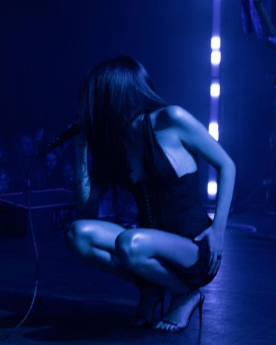 Maggie Lindemann dressed in a black gown paired with bold rings.