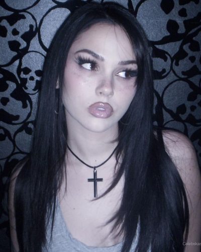 Maggie Lindemann stylish high-waisted jeans and necklace