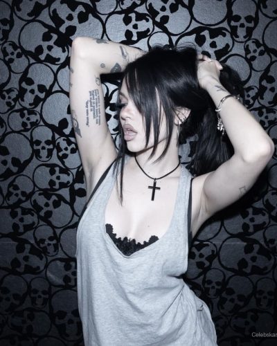 Maggie Lindemann gray tank top paired with lace