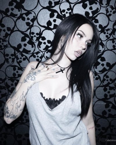 Maggie Lindemann trendy cropped tank and high-waisted jeans