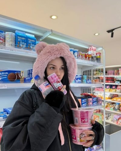 Maggie Lindemann black cross necklace with punk style