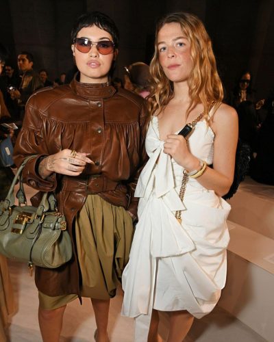 Maggie Rogers stylish accessories enhancing white dress appearance