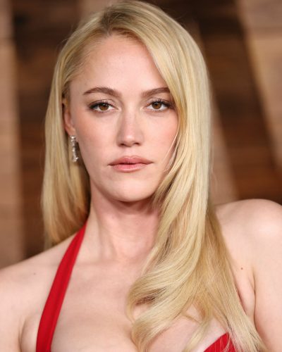 Maika Monroe in minimalistic jewelry with red gown