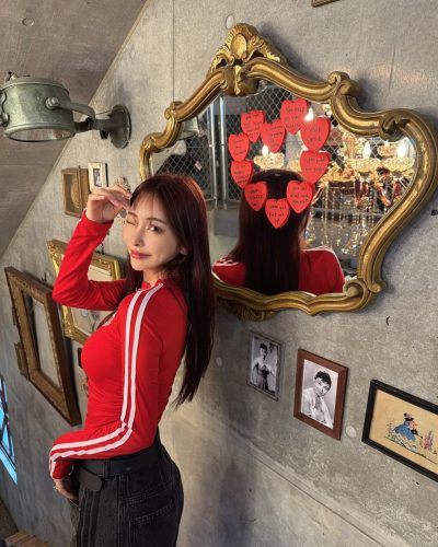 Makoto Minami wearing oversized sweater with stylish tailored shorts.