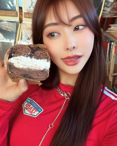 Makoto Minami with simple hoop earrings and oversized sweater.