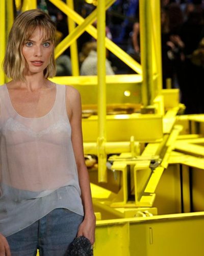 Margot Robbie soft waves hairstyle enhancing natural beauty.