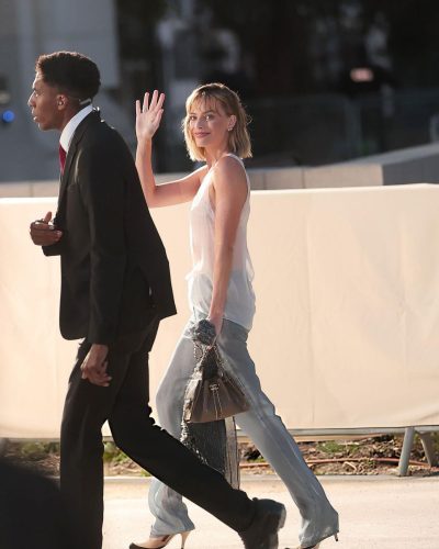 Margot Robbie elegant jewelry pieces complementing her style.