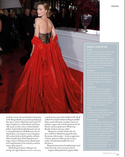 Margot Robbie in a pastel floral dress with a relaxed fit.