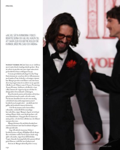 Margot Robbie wearing a floral dress with a light and airy feel.