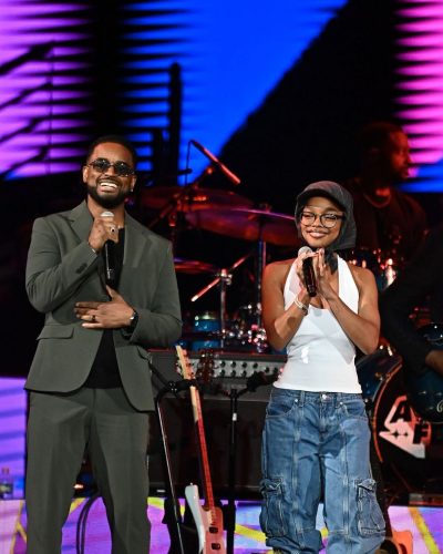 Marsai Martin in white tank top paired with knee-high boots
