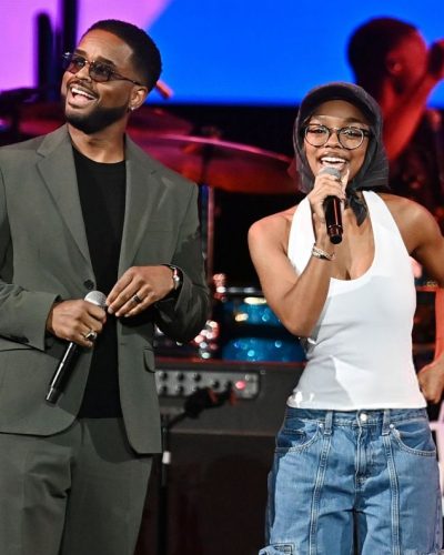 Marsai Martin in oversized denim joggers and stylish black cap