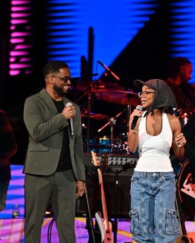 Marsai Martin wearing knee-high embroidered boots with colorful details