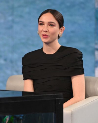 Matilda De Angelis fitted black dress with delicate detailing and heels