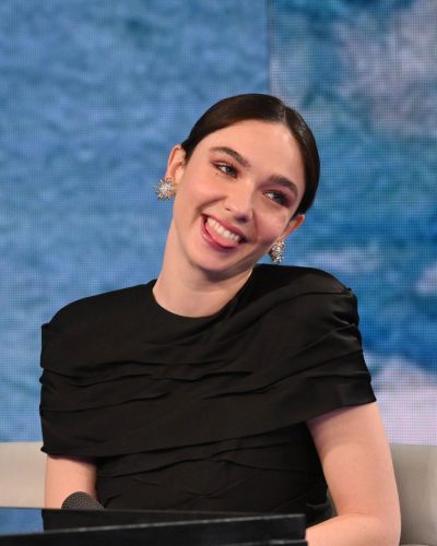 Matilda De Angelis modern black gown with intricate textures and heels