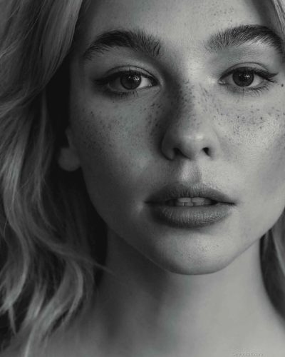 Matilda De Angelis in eye-catching red dress with minimalistic design.